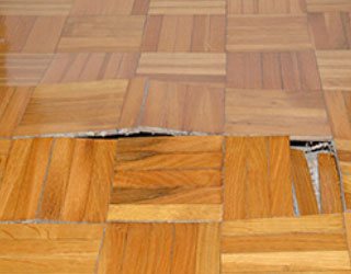 hardwood floor damaged by moisture and water.