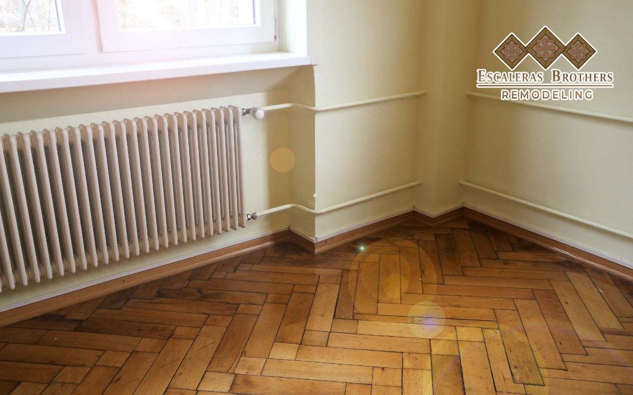 A professionally installed herringbone hardwood floor pattern.